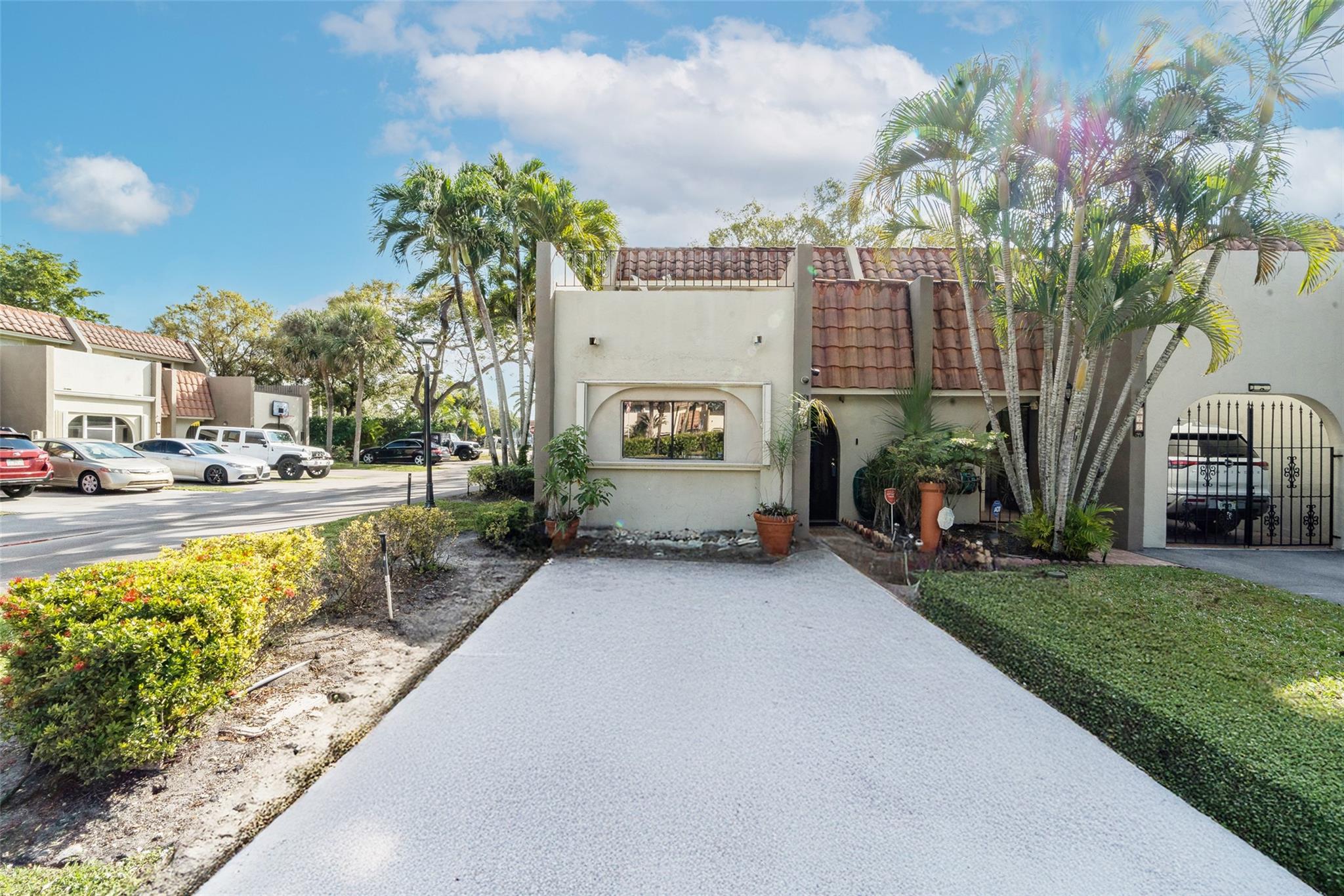 Spacious 4BR/2.5BA corner townhome in the sought-after Jacaranda Community of Plantation! Over 2,300 SF, offering a blank canvas for customization. Upstairs: massive primary suite w/ balcony + 2 large bedrooms. Main level: open living space, flex room/bedroom, half bath & kitchen ready for your vision. Roof seal coating project done (2021), AC (2019), exterior paint (2019), pavement (2023). Accordion shutters on all windows. Large driveway (room for 2 vehicles), community pool & serene surroundings. Lots of closets/closet space in unit. Prime location—walk to Central Park & Jacaranda Country Club!