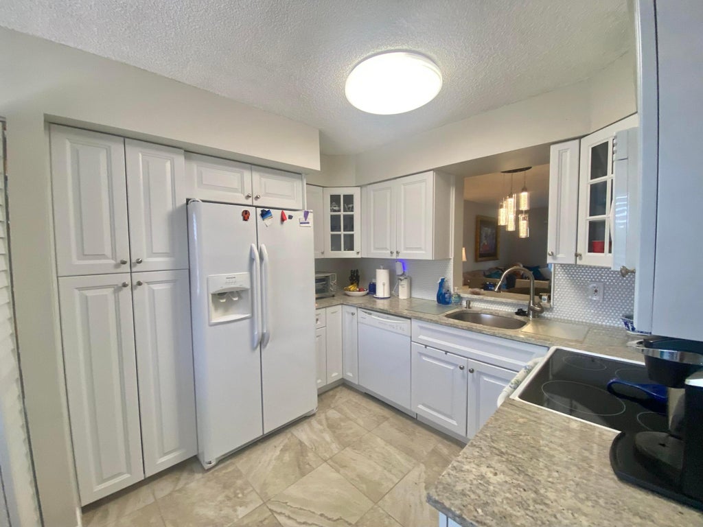 Photo of 7281 Amberly Lane #404, Delray Beach, FL 33446 (MLS # B26082453)