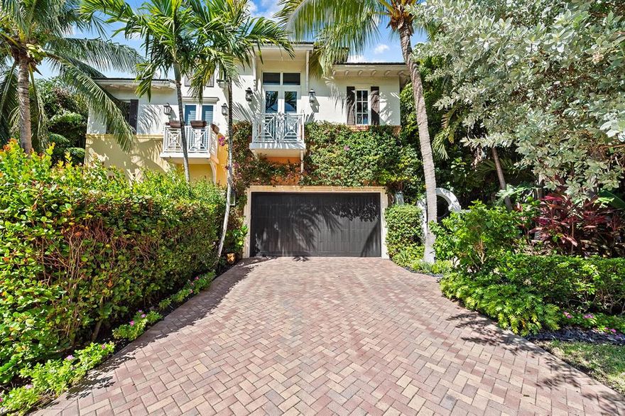 Beautifully fully-renovated contemporary townhome just steps away from Atlantic Avenue and the beach in East Delray. The herringbone brick paved walkway lined with professional landscape lighting leads you to a charming secured gate into a magical oasis where you can retreat from all of Delray's famed attractions. This three bedroom townhome has been meticulously redone from top to bottom with the finest designer finishes, light fixtures and white oak flooring throughout. Step into the primary living area with an open layout, luxurious wall coverings and lighting perfect for entertaining. The gourmet kitchen features stunning marble countertops, sleek wood cabinetry, open shelving, a 6 burner Thermador gas range, Miele Dishwasher, Subzero refrigerator and on-trend gold hardware from RH.