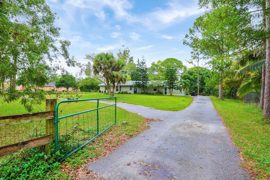 Photo of 11821 62nd Lane N, West Palm Beach, FL 33412 (MLS # R10953803)