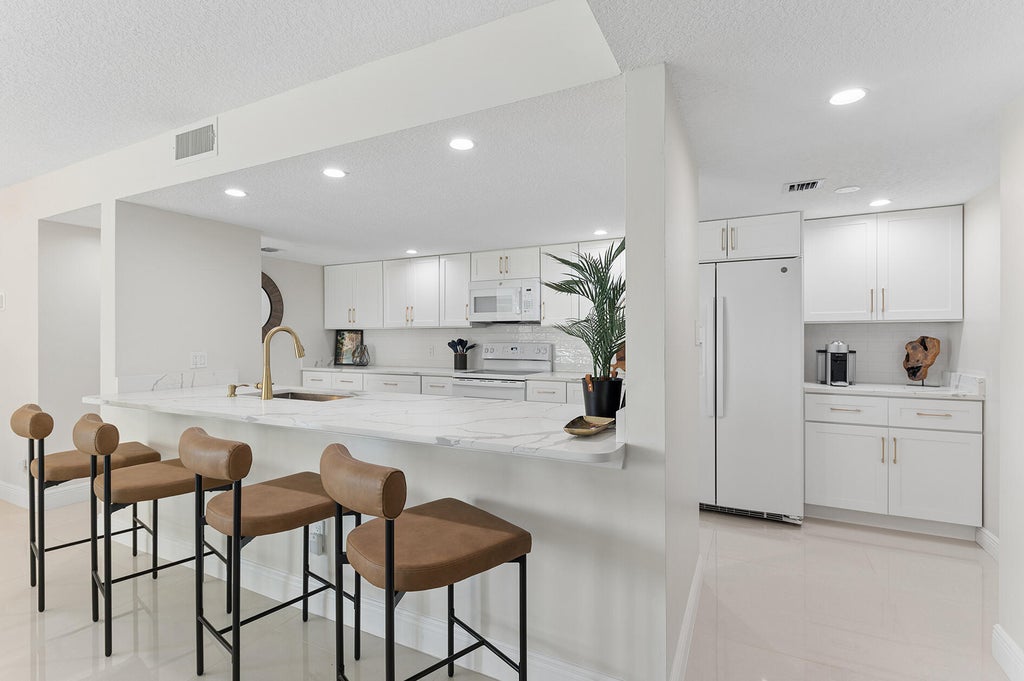 Photo of 2025 LAVERS Circle #D404, Delray Beach, FL 33444 (MLS # B26093632)