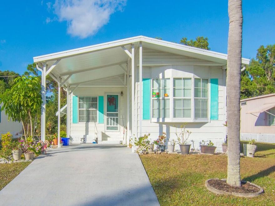 Welcome to 8 Novedades, a charming and affordable home located in Spanish Lakes Golf Village, an active 55+ community known for its friendly atmosphere and resort‑style amenities. This spacious 2‑bedroom, 2‑bath residence offers 1,350 sq ft of comfortable living space designed for relaxation, entertaining, and enjoying the Florida lifestyle. It features a large living room and a cozy family room with a brand new AC. The home also features a dedicated laundry room with washer and dryer, plus a large screened porch—perfect for morning coffee, evening breezes, or hosting friends year‑round. The split‑bedroom floor plan provides privacy for you and your guests.  Lot rent is only $800 per month which includes all amenities of the clubhouse and lawn maintenance.