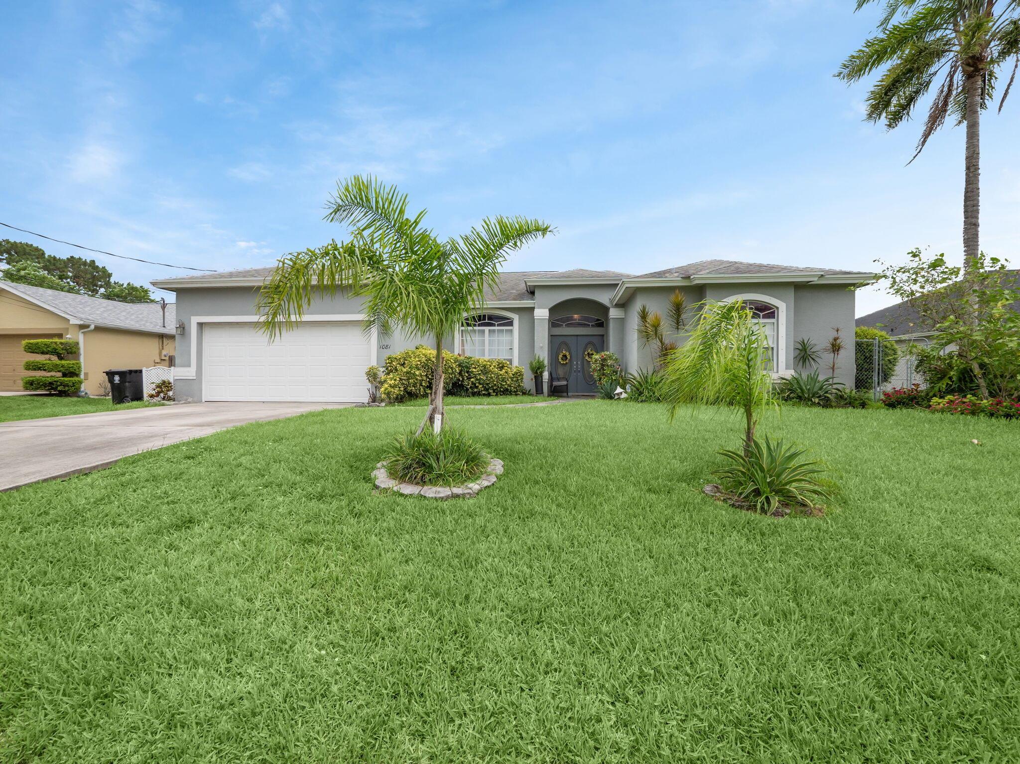 This charming 4-bedroom, 2-bathroom home offers double-door entry that leads to a bright, open floor plan with 10-foot ceilings and a seamless flow between the living, dining, and family areas. The spacious kitchen features granite countertops, a center island, a breakfast bar, and an eat-in area, making it ideal for both everyday living and entertaining. The master suite boasts two large walk-in closets and direct access to the covered, screened-in patio. The master bathroom includes a Roman tub, separate shower, and dual vanities. Save money with the canal-fed sprinkler system. Located minutes from I-95 via Crosstown Parkway, this home offers easy access to shopping, dining, and entertainment.