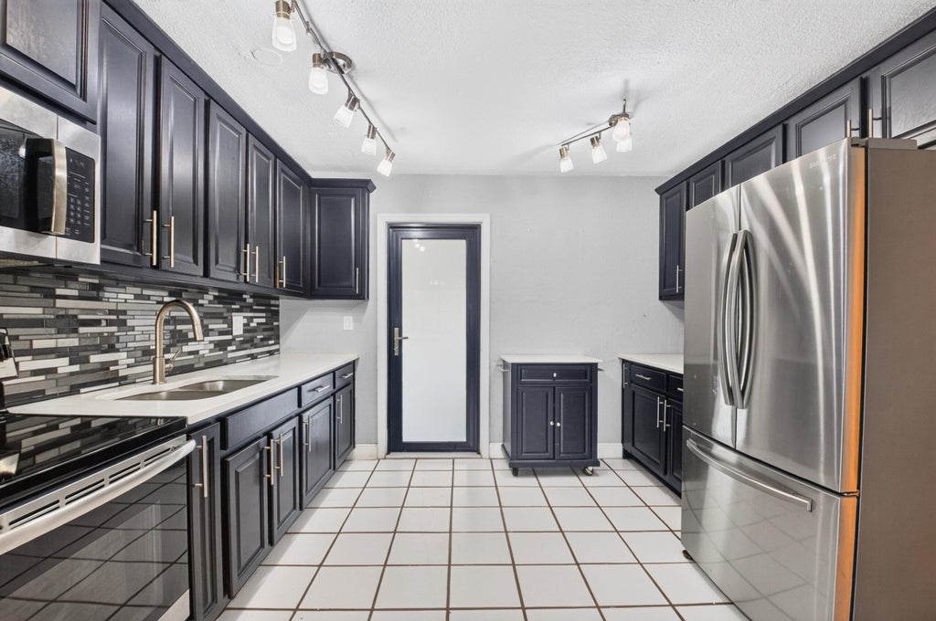 Photo of 528 BEECH Road, West Palm Beach, FL 33409 (MLS # B26093589)