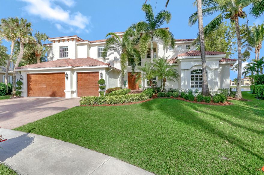 GORGEOUS! CUSTOM BUILT MODEL LIKE NO OTHER! BEST LAKE LOT WITH HEATED POOL, SPA, OUTDOOR GRANITE KITCHEN, THIS over 8500 total SQ FT AMAZING HOME HAS EVERY BELL & WHISTLE! Enter thru a marble ctr hallway to open and airy living area, incredible stone fireplace, magnificent high ceilings, & outstanding architecture. WATER EVERYWHERE! 6 bedrooms, ALL with 6 full baths, including a cabana bath, 2 lofts, media room and office, balconies overlooking the pool and lake from upstairs,  closets the size of most rooms! MASTER 1ST FLOOR WITH HUGE SITTING AREA, CAN ALSO BE used as nursery/office. 2nd Master also on ground floor, with guest/den/office as well. For the buyer who wants a huge home, move in ready,for a great price, better than new! Impact glass, shutters, LOVE THIS HOME! Huge price drop!