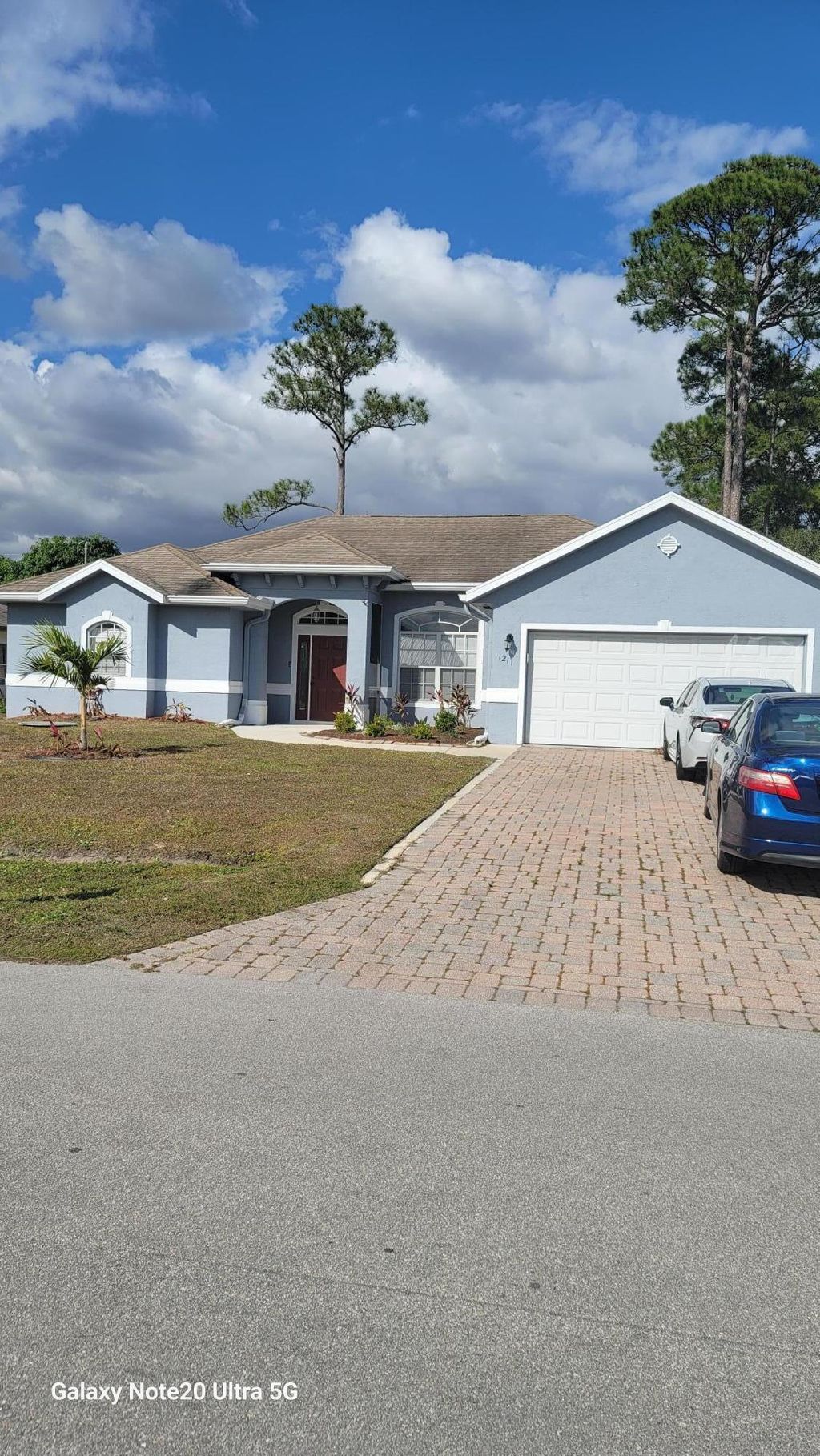 Photo of 1211 SW Wellington Avenue, Port Saint Lucie, FL 34953 (MLS # R11156433)