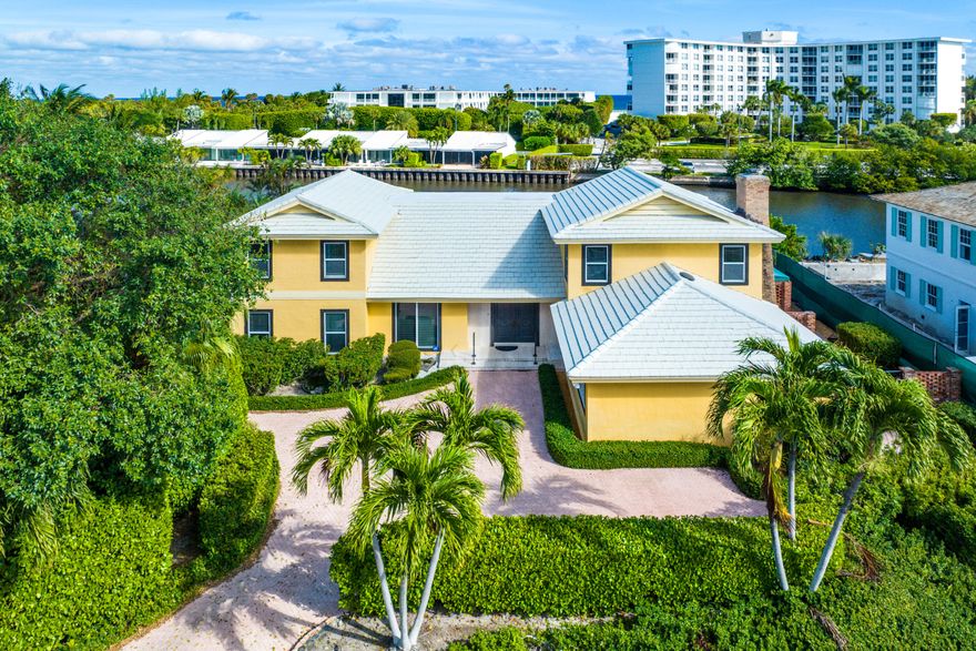 Discover waterfront living on Palm Beach's sought after Ibis Isle. This 4 bedroom, 4 bathroom home on the East side offers Palm Beach living near the Ocean. With high ceilings and wonderful floor plan, the home features a two-story living room with a grand staircase (potential space for an elevator) and a chef's kitchen flowing into a spacious dining area and family room. The grand primary suite boasts ample closets and a luxurious bath. Newer windows throughout. Outside, a pool overlooks the waterway and is surrounded by mature trees. Potential for a dock. Ibis Isle is located across A1A from Phipps Ocean Park, Palm Beach Tennis Center, and Palm Beach Par 3 golf. A short drive leads to Worth Avenue, 5 star hotels, shopping,  fine dining and cultural centers.