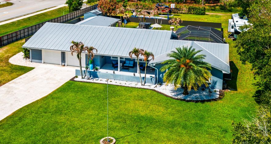 Beautifully updated 4br/3bath home with a dedicated office space, located in the heart of Stuart. Set on just under an acre, this partially fenced property offers privacy, with space and room for your RV and boating parking. Low HOA fees' Completely move-in ready, with new flooring and custom upgrades throughout , delivering a modern high=end feel. Metal roof 2015, HVAC 2024, Water heater 2025, and city water hook-up. The outdoor space is designed for entertaining with a stunning screened -in pool, a brand new above ground spa and a custom-built barbeque and bar area ,perfect for hosting and enjoying Florida living year-round. A rare opportunity collecting location, land, and lifestyle! House is on a key code