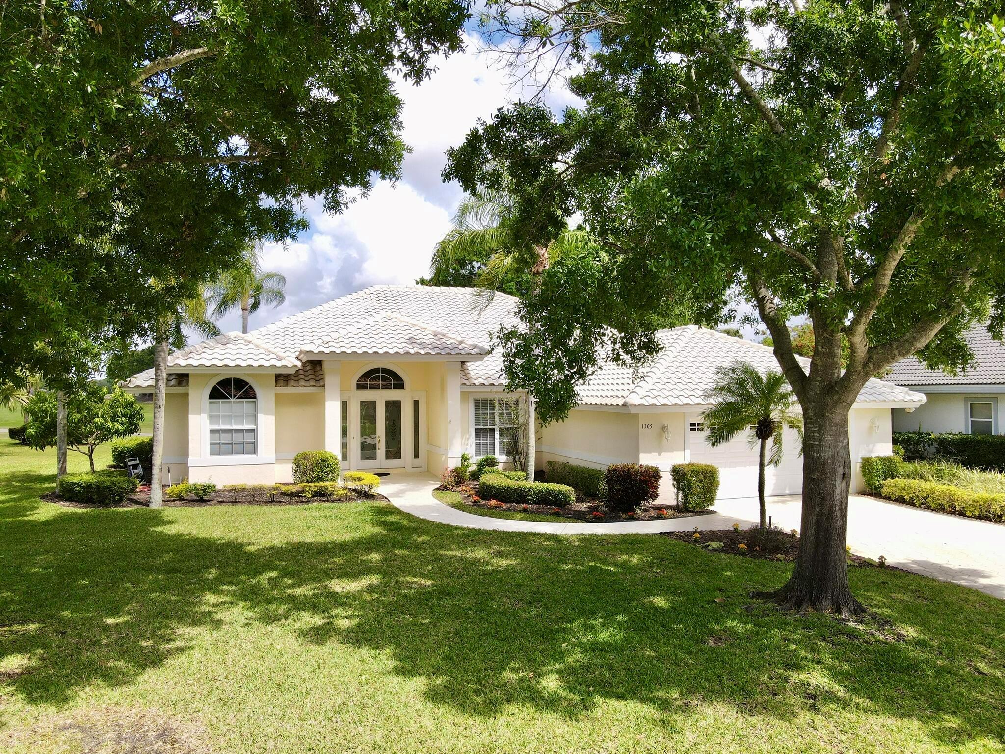 ENJOY YOUR MORNING COFFEE PARTAKING IN NATURES GLORY - OVERLOOKING THE 4TH GREEN! GOLF FRONT - POOL HOME...THIS AMAZING LIGHT AND BRIGHT HOME FEATURES SOARING CEILINGS, NATURAL LIGHT THROUGHOUT, 12' CEILINGS, UPDATED KITCHEN WITH SMOOTH GRANITE, STAINLESS STEEL APPLIANCES, SOLAR TUBE, TILE FLOORS, CABINETRY IN LAUNDRY, SPLIT FLOOR PLAN, TONS OF STORAGE AND CLOSETS, POOL WAS RECENTLY RESURFACED, HUGE LANAI ALL COVERED AND SCREENED, LUSH LANDSCAPING AND SO MUCH MORE!