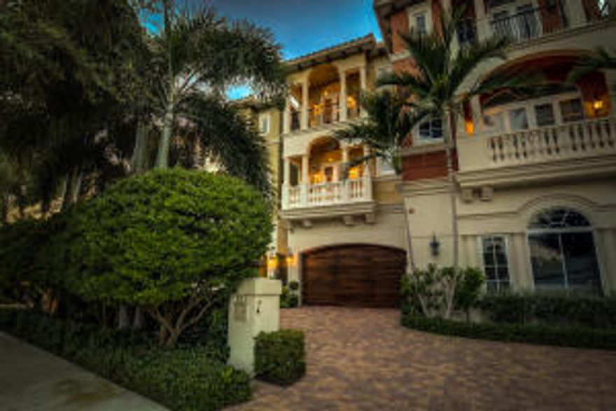 Almost new and rarely used 3-story townhome directly on Intracoastal with dock. This immaculate home designed by renowned developer National Custom Homes includes: Fireplace, Elevator, chef's kitchen, electric shades, balconies off all Intracoastal-facing rooms, coffered ceilings, marble, onyx, alarm, lutron lighting, fine wool carpet and so much more. A perfect paradise with private heated pool, supreme privacy and deck/dock to watch the boats go by. Priced for a quick sale.