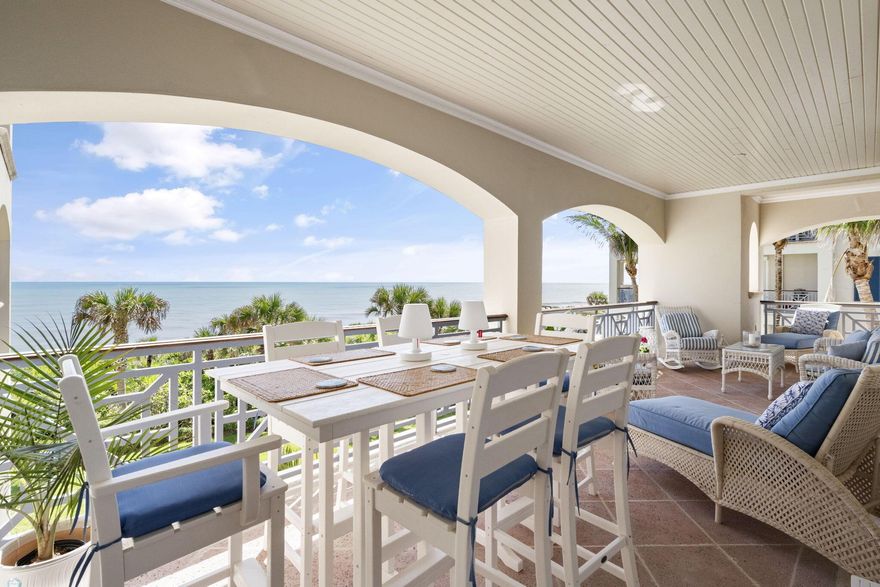 Oceanfront luxury with breathtaking panoramic views! This stunning condo offers a wraparound porch with full southern exposure--perfect for sun-soaked mornings and ocean breezes. Just steps from the beach, enjoy 10-foot ceilings, extensive molding, and an open, airy layout. Located in a guarded, golf community offering privacy, security, and top-tier amenities. Live the fabulous Florida lifestyle in style and comfort with unmatched views and coastal elegance. A rare gem!