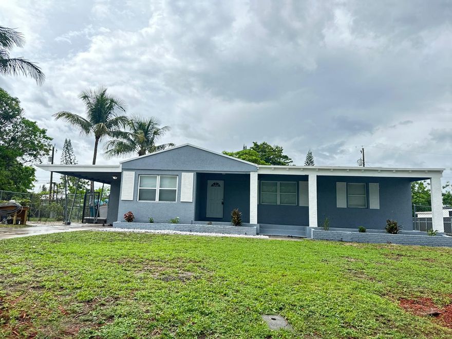 Welcome to your dream home! This stunning 4-bedroom, 3-bathroom residence has been meticulously renovated and is move-in ready. NO HOA. Centrally Located, just minutes away from the beach and close to major highways and shopping centers. The main home boasts 3 spacious bedrooms and 2 modern bathrooms, alongside a versatile efficiency unit perfect for guests or extra income. Step into the updated kitchen with sleek stainless steel appliances, ideal for culinary enthusiasts. Enjoy the comfort of brand-new flooring throughout and the efficiency of a new A/C system. The yard is effortlessly maintained with a newly installed sprinkler system.  Don't miss out on this perfect blend of luxury and convenience! The appraisal is attached under document.