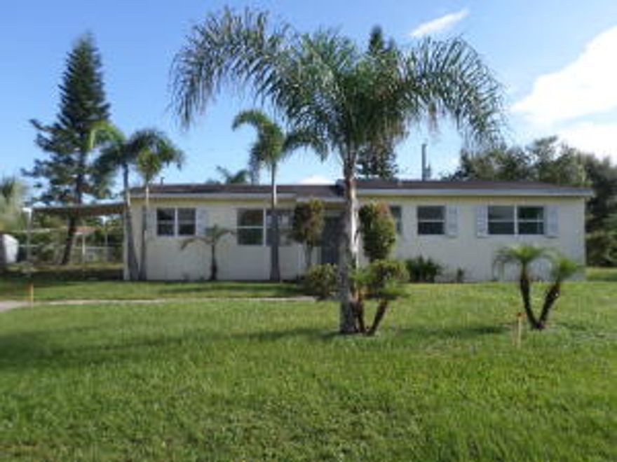 Lovely bungalow, brick home offers a spacious backyard, single carport, living/dining combo w/sliding glass doors opening to an open patio, galley kitchen, and 3 spacious bedrooms including a master suite w/full bathroom. Entire home offers terrific terrazzo floors! Terrific location just blocks from Warfield Elementary, Indian River Community College, restaurants, the library, Timer Powers Park, and Indiantown Middle School! EQUAL HOUSING OPPORTUNITY.
