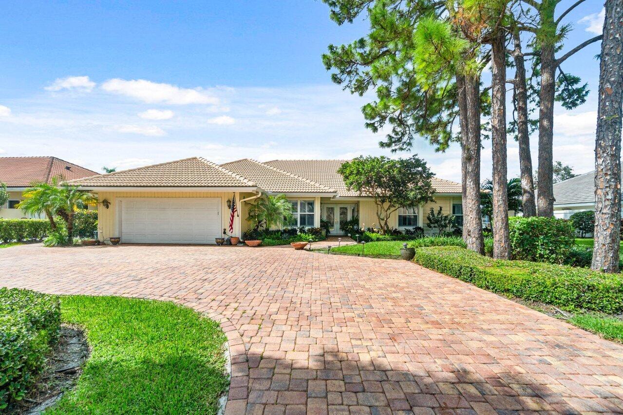 Nestled in the prestigious Marlwood Estates of PGA National, this stunning lakefront home offers 3 beds, 3 baths, Plus a large Den with serene, wide water views with a SE exposure. This elegant residence features an open floor plan filled with natural light, a spacious upgraded kitchen, and Large open dining area perfect for entertaining. Step outside on a large .33 acre lot with screened lanai patio and sparkling pool, perfect for year-round outdoor living. The expansive master suite provides an updated spacious bathroom and private retreat with direct pool access and tranquil water views. Enjoy world-class golf, tennis, and resort-style amenities in this highly desirable PGA National Community.
