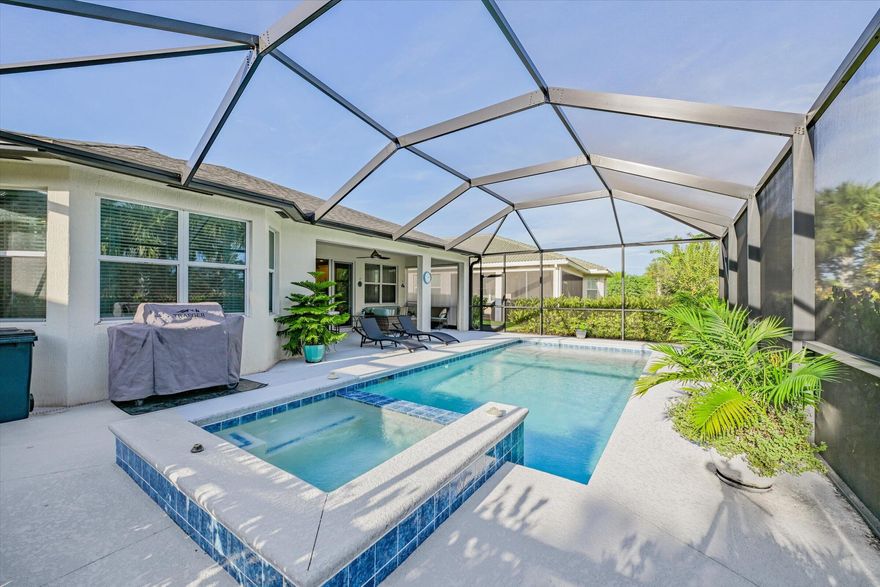 Beautifully upgraded 2BR/2BA + Den pool home in the 55+ community of Lake Park at Tradition! Features over $100K in upgrades including custom tile flooring, 9-ft ceilings, and an open-concept layout. Gourmet kitchen with granite countertops, stainless steel appliances, and ample cabinetry. Spacious primary suite offers dual walk-in closets, double vanities, and a walk-in shower. Hurricane-impact windows and doors throughout. Enjoy your private backyard oasis with screened lanai, heated saltwater pool, hot tub, and lush tropical landscaping. Lake Park offers resort-style amenities including two clubhouses, two pools, tennis, pickleball, basketball, and dog parks. Ideal low-maintenance living, conveniently located near I-95