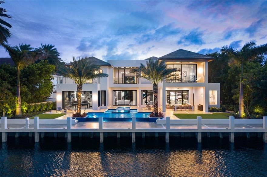 NEW CONSTRUCTION HOME. FINISHED AUGUST 2020 Waterfront estate designed by renowned architect Randall Stofft. This home marries a modern aesthetic with organic finishes to exude elegance and warmth. This 8,273 SF AC estate features a lavish master suite with dual master baths and closets. This furnished estate provides extraordinary amenities, including spacious clubroom with wet bar, elevator, 7-seat theater, 560 bottle wine room & pet grooming area. Chef's double island kitchen includes Miele & Wolf appliances. Located in Harbor Beach, a private beach club community, this modern estate is situated on one of the most sought-after streets. The oversized lot offers 105' WF on an ultra-wide canal. Summer kitchen, outdoor dining and infinity pool. Home comes turnkey furnished