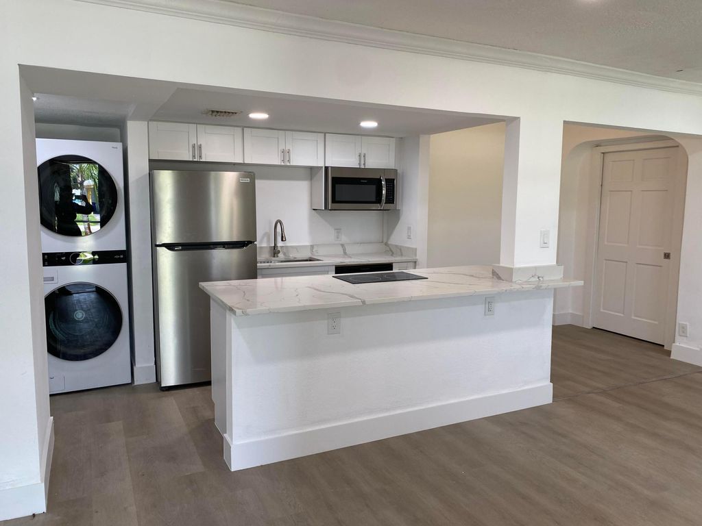 Photo of 330 Cypress Drive #B, Lake Park, FL 33403 (MLS # R11017601)