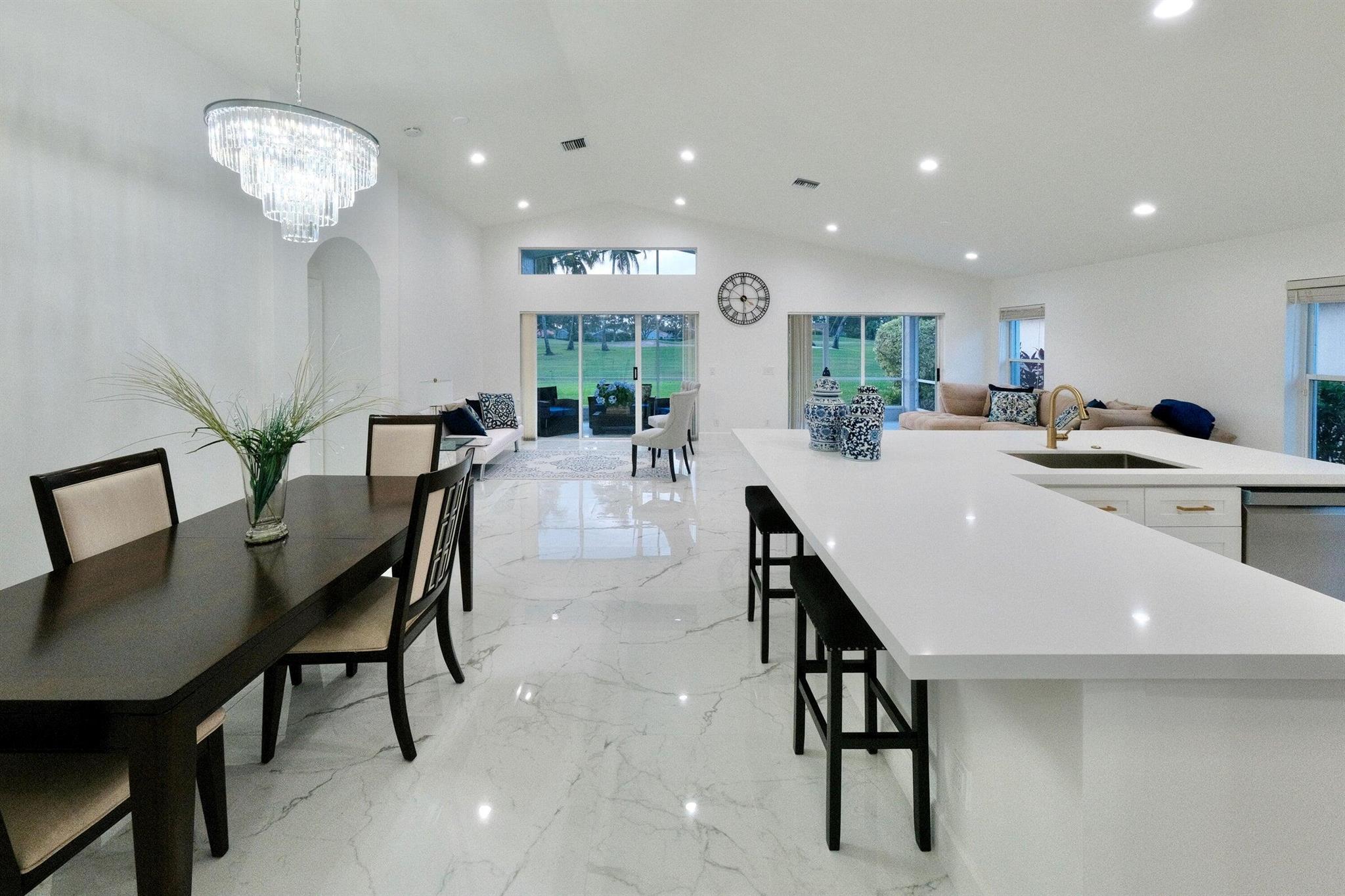 *MUST CALL LISTING AGENT FOR GATE ACCESS* Completely renovated with panoramic Golf Course views! Stunning home in fabulous Cascades. Brand new Porcelain Tile, new Baseboards throughout, all new Gourmet Kitchen with new Cabinetry, all new Appliances, new Quartz Counters and gorgeous Island with seating. Freshly painted inside and out, new LED lights throughout and new shimmering glass chandelier really make this home shine. Baths have new vanities, new efficient toilets, frameless glass shower in guest with fresh new tile. 24/7 manned gate. Recently renovated Clubhouse, with ballroom, gym, card & billiards rooms, enormous theater, pottery & painting rooms, craft room & separate cafe, entertainment and more. Resort style pool, pickleball, tennis. Complete accordion shutters; 2020 A/C