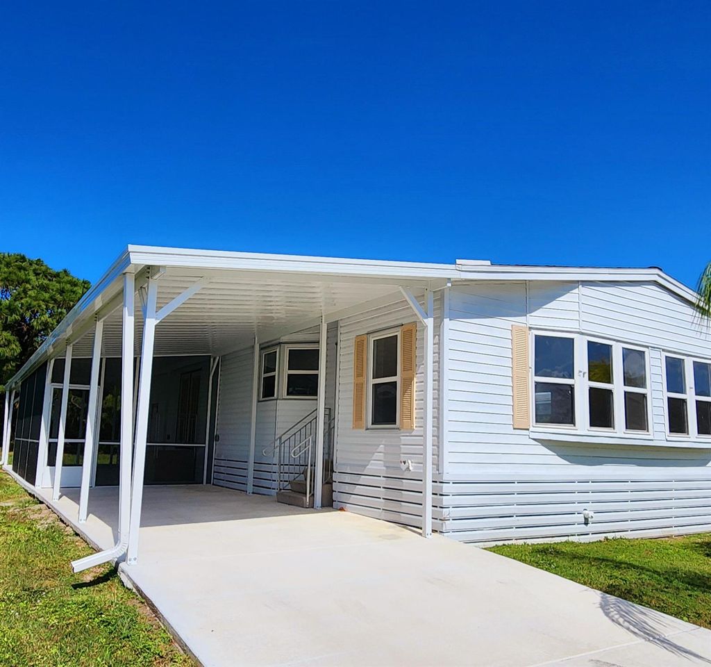 Photo of 184 W Caribbean, Port Saint Lucie, FL 34952 (MLS # R11032524)