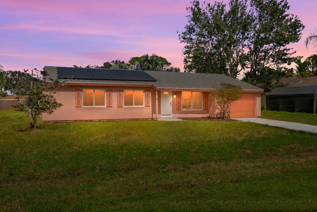 Photo of 1449 SE Minorca Avenue, Port Saint Lucie, FL 34952 (MLS # R11132546)