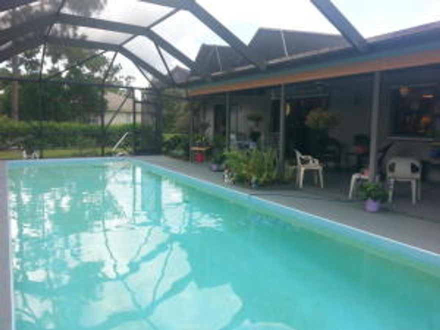 Priced for immediate occupancy, this 3 bedroom,2 bath, 1 car garage, screened in pool home is located on a paved road, close in location, new carpet and tile, hardiboard siding, newer roof, screen pool/patio and back yard faces east for a southeast breeze. Landlord has put in new tile and new carpet.