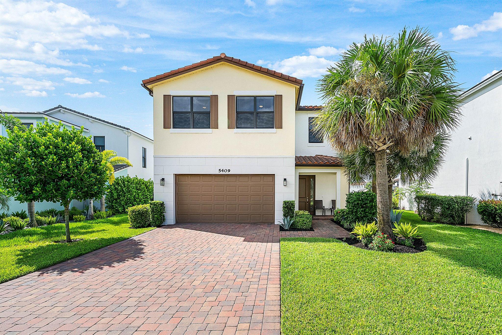 Experience elegant lakeside living in this upgraded home perfectly positioned on a premium lakefront lot in Westlake. Built in 2021, it offers 3 bedrooms plus loft and sitting room, impact windows, sealed tile grout, crown molding, granite counters, and stainless-steel appliances. The paint is a premium gloss finish, easy to clean and maintain. The garage features epoxy floors and storage racks. Enjoy stunning lake views and resort amenities including pools, splash pad, courts, and playgrounds. Nearby shopping and dining complete this luxury lifestyle.