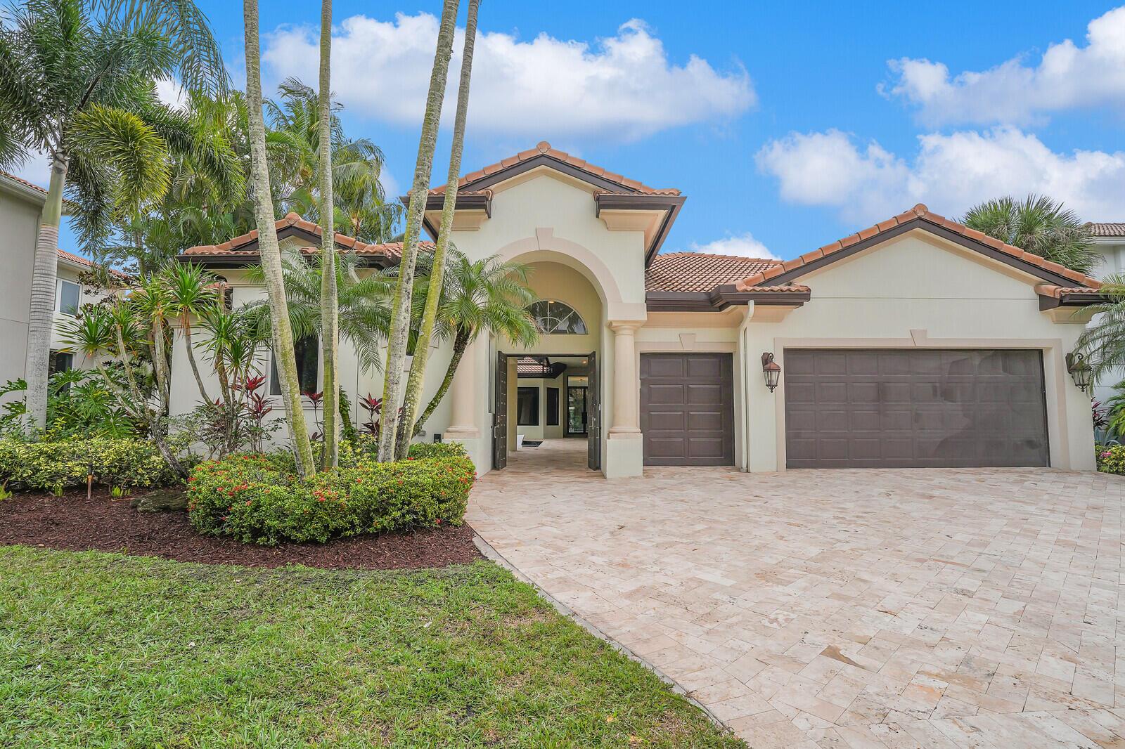 Experience unparalleled elegance in this fully renovated 3,600 sq ft courtyard home, nestled within the distinguished Mizner Country Club in Delray Beach. Exquisitely designed, this 4-bedroom, 3.5-bathroom home, along with a private office, offers an open and airy floor plan, high ceilings, and premium finishes throughout. The gourmet kitchen is a culinary masterpiece, featuring top-of-the-line Wolf and Sub-Zero appliances, including a 60'' side-by-side refrigerator/freezer, three ovens, warming drawer, and a Miele built-in coffee station. A large quartzite island with dual sinks, two dishwashers, and custom cabinetry provides ample space for both cooking and entertaining.