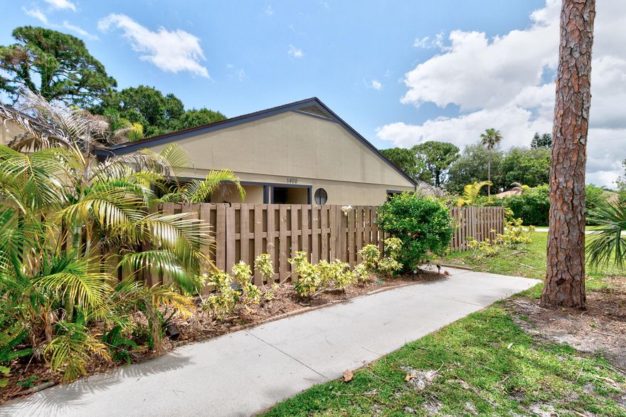 Enjoy the easy, care-free Florida lifestyle in this charming villa that feels like a house -- but you don't have to do the lawn! Wonderfully maintained with a 2021 roof, 2024 ac, 2025 water heater and a brand new range. Other features include tiled floors throughout, stainless steel appliances, inside laundry room, big primary bedroom, a terrific brick paver courtyard, and there are built-ins in the dining room for tons extra storage - along with a coat, linen and outside closet for all your stuff! Low fee HOA takes care of the landscaping, irrigation, termite policy and master insurance.