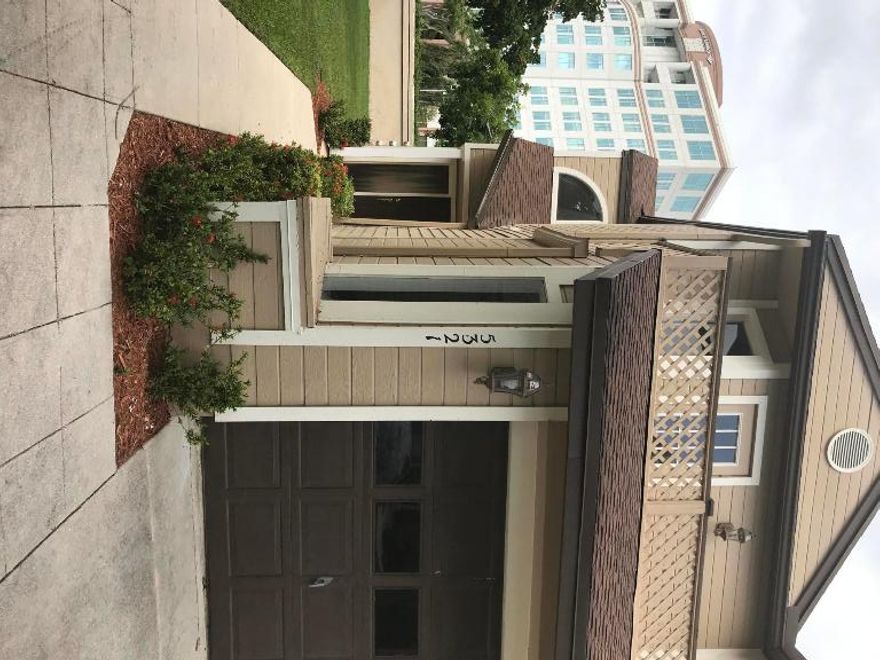 LOCATION! LOCATION!! : BEAUTIFUL CORNER CARRIAGE HOUSE - BRIGHT AND AIRY OFFERS 2 BEDROOM 2 BATH GROUND FLOOR WITH 1 CAR GARAGE, CATHEDRAL CEILINGS, HOME OFFERS WOOD LAMINATE AND CERAMIC TILE FLOORING. AND SCREENED IN PATIO. CENTRALLY LOCATED WITH WALKING DISTANCE FROM THE SHOPS AND RESTAURANTS@ BOCA CENTER, CLOSE TO I95, TRI-RAIL STATION, FAU, BOCA CENTER AND TOWN CENTER. SHORT DRIVE TO THE BEACH AND TURNPIKE, BOCA RATON DOWN TOWN. RENOVATED, NEW KITCHEN CABINETS AND BATHROOM CABINETS, NEW BATHROOM FIXTURES!