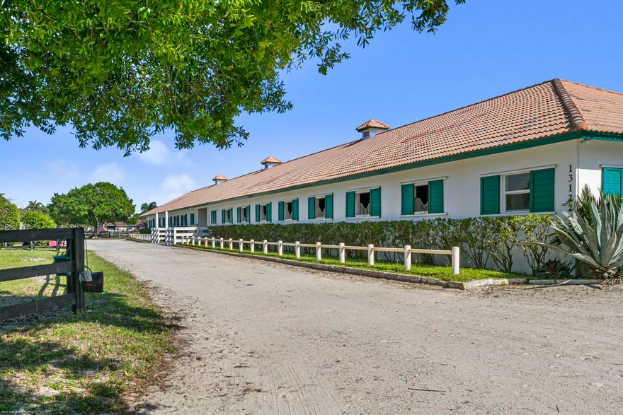 10.32-acre equestrian farm ideally located in Wellington's South end, close to the back gate of the Wellington International Showgrounds.  CBS center aisle stable on a quiet street featuring 30 stalls, 2 tack rooms, 2 feed rooms, and 2 storage rooms.  The property includes 2 all-weather arenas with fiber footing, round pen, multiple paddocks, a large storage garage and a grass jumping field. Three staff residences: 3BR/1BA, 2BR/1/BA, and 1BR/1BA. Well-designed for a professional operation, an excellent layout for horses comfort, with room for expansion.