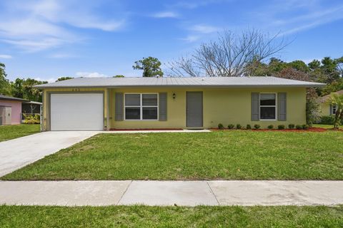 Photo of 445 NE Armory Circle, Port Saint Lucie, FL 34983 (MLS # B26016495)