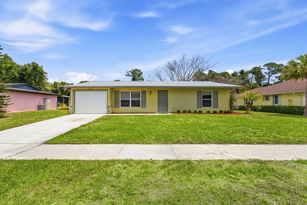 Photo of 445 NE Armory Circle, Port Saint Lucie, FL 34983 (MLS # B26016495)