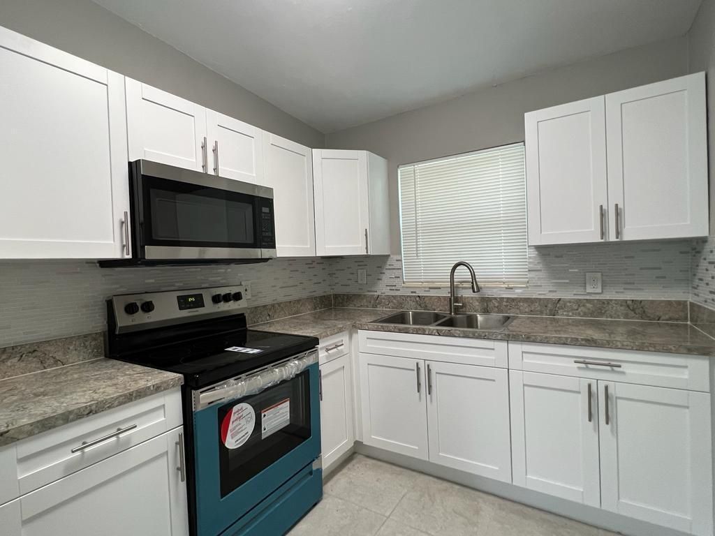 Photo of 3990 Plum Tree Drive, Lake Worth, FL 33462 (MLS # R11155016)