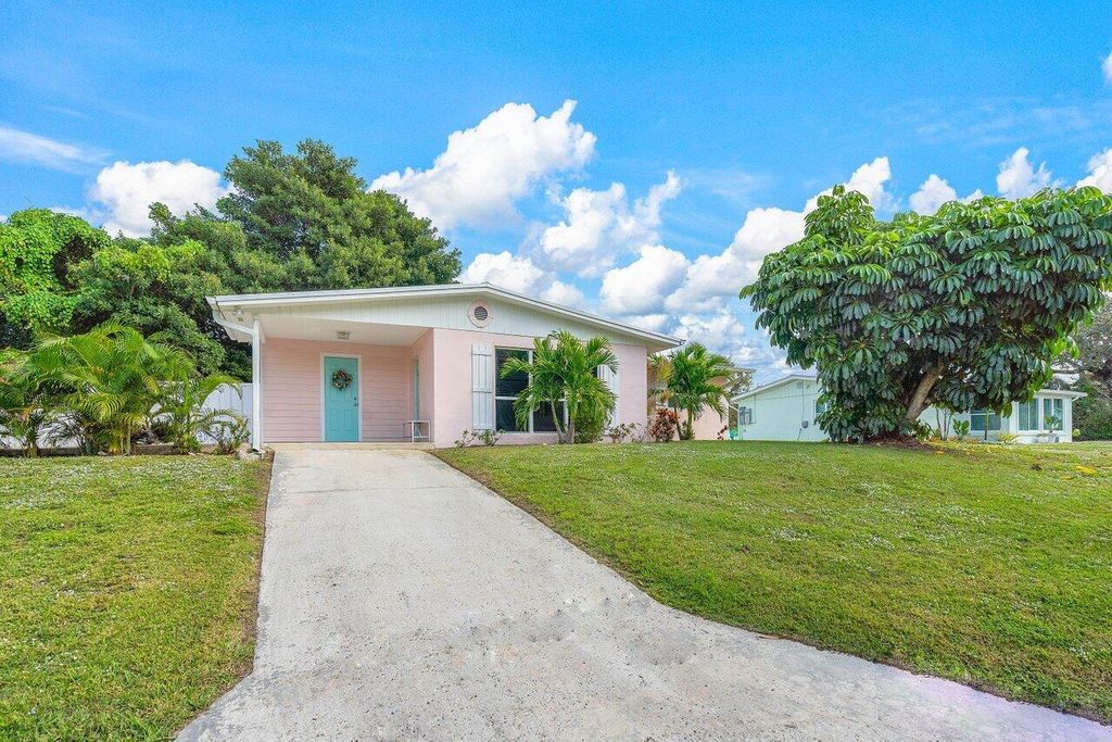 Photo of 2057 NE Ridge Avenue, Jensen Beach, FL 34957 (MLS # R10943210)