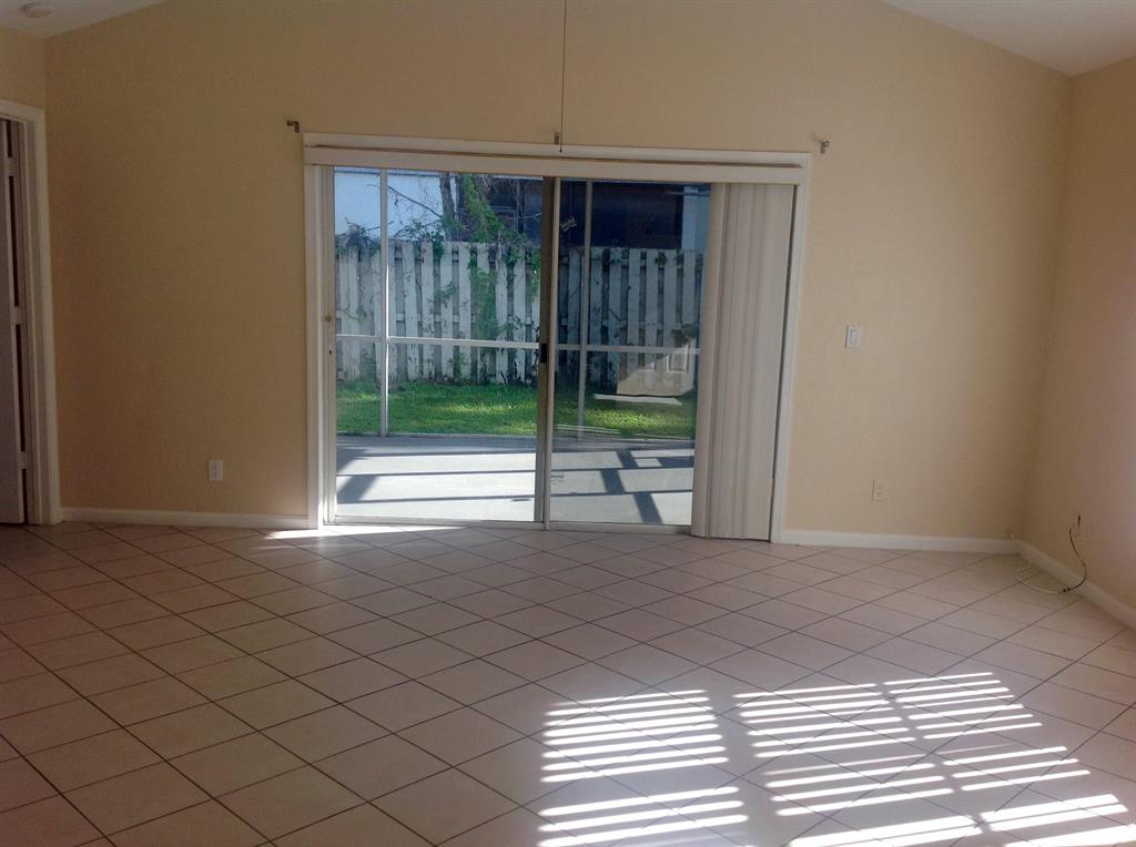 Fantastic villa in a very convenient location in Wellington. Walking distance to shopping plazas. It features 3 bedrooms, 2 baths, 1 car garage, screen enclosed patio, and L shape fenced backyard. Tiled through out, cathedral ceiling in living room, spacious bedrooms. No HOA, trucks are allowed. Rated A school zone.