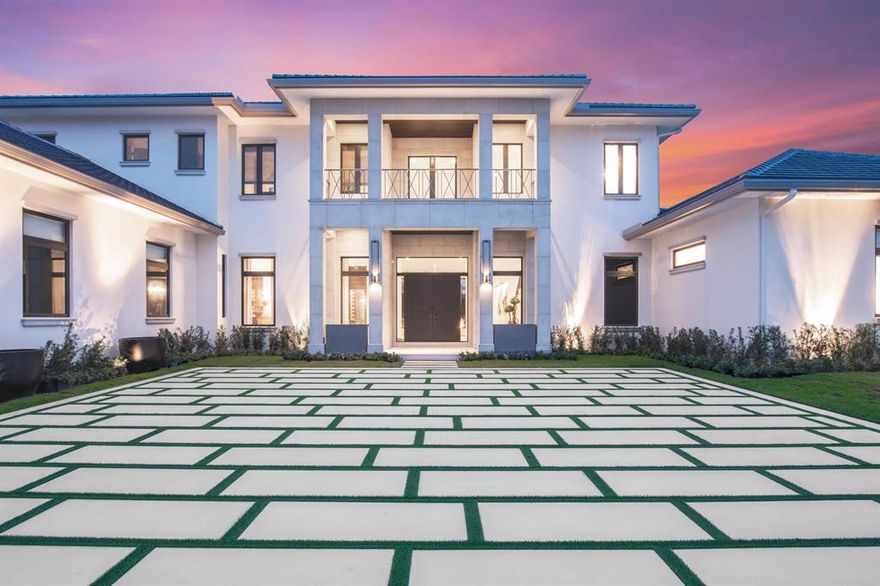 This gorgeous new construction state of the art home is located in the sought-after Cypress Island at Palm Beach Polo and Country Club. Yellowfin Builders and HW Interiors have partnered in creating this magnificent custom estate. Beyond the front doors lies a grand formal living space with oak flooring throughout, featuring massive windows overlooking the pool and lake. The right wing of the home consists of the breathtaking master suite that includes two large walk in closets, a dreamy master bathroom, makeup area, coffee bar and direct access from bedroom to spa & pool. Also located in the right wing of the home is a large office finished with beautiful coffered ceilings and serene water views. The left wing of the home offers a formal dining room, a custom wine room, family room, bedroom with ensuite bathroom and a state of the art kitchen. The wide open kitchen is a chef's dream finished with top of the line appliances, a gas cooktop, custom cabinets, and double islands. The kitchen overlooks the outdoor living area complete with a summer kitchen, double sided fireplace and a full cabana bath with shower. Upstairs you can enjoy a large loft with a balcony overlooking the pool and lake. In addition, there are four bedrooms upstairs enjoying their own ensuite bathrooms and an upstairs laundry room. Other features include: state of the art pool with a wet edge, sun shelf, spa, and fire bowls, smart home system, covered patio, custom railings throughout, two laundry rooms and a 3 car garage. This estate home is nothing short of special and is finished with the highest quality materials. Don't miss out on the opportunity to make this dream home yours and enjoy all that the luxury lifestyle has to offer.