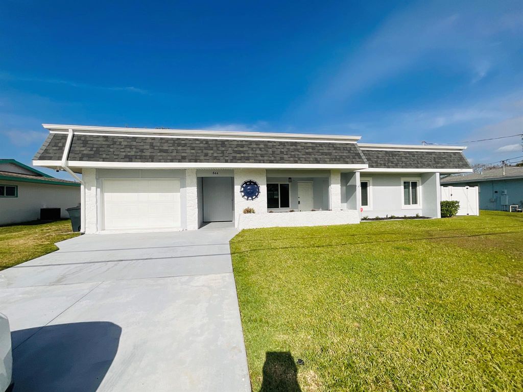 Photo of 864 SE Degan Drive, Port St Lucie, FL 34983 (MLS # R10976800)