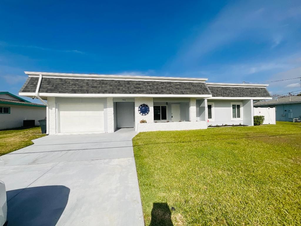 Photo of 864 SE Degan Drive, Port Saint Lucie, FL 34983 (MLS # R10976800)