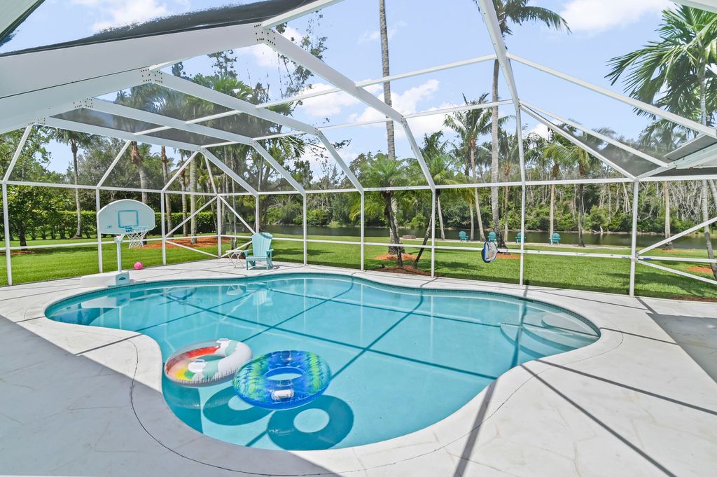 Photo of 5637 Lago Del Sol Drive, Lake Worth, FL 33449 (MLS # B26033845)