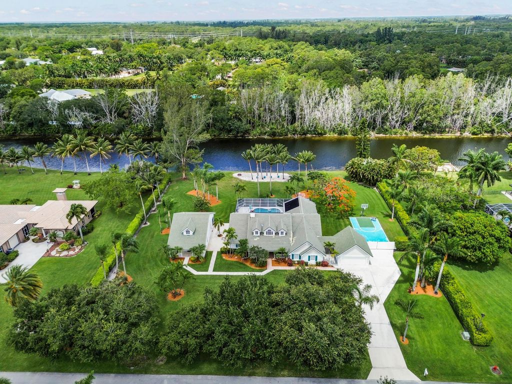Photo of 5637 Lago Del Sol Drive, Lake Worth, FL 33449 (MLS # B26033845)