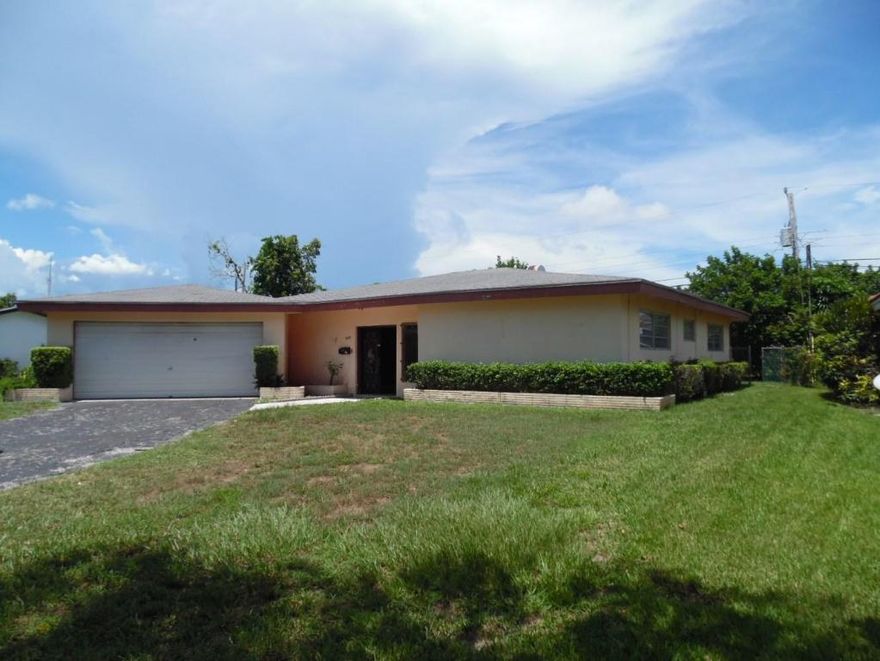 Come and grab this house while it is available and ready to go! Nice big lot, with a screened in back patio, open brick cooker, fruit trees, and room for a pool! This light, bright, open floor plan has a side area off the kitchen you can use as a computer station, a dining area off the other side of the kitchen, large family room, 3 full, good sized bedrooms, laundry inside the house off the 2 car garage, a foyer and a walk-in hall closet for additional storage! This home has a BRAND NEW ROOF! That's a huge savings! Come and bring your paint colors, kitchen cabinets, carpet, tile and create your very own master piece from this solid, open canvass. There is NO HOA! And it is centrally located to everything WPB has to offer! Minutes to downtown, I95, City Place, everything at your fingertips