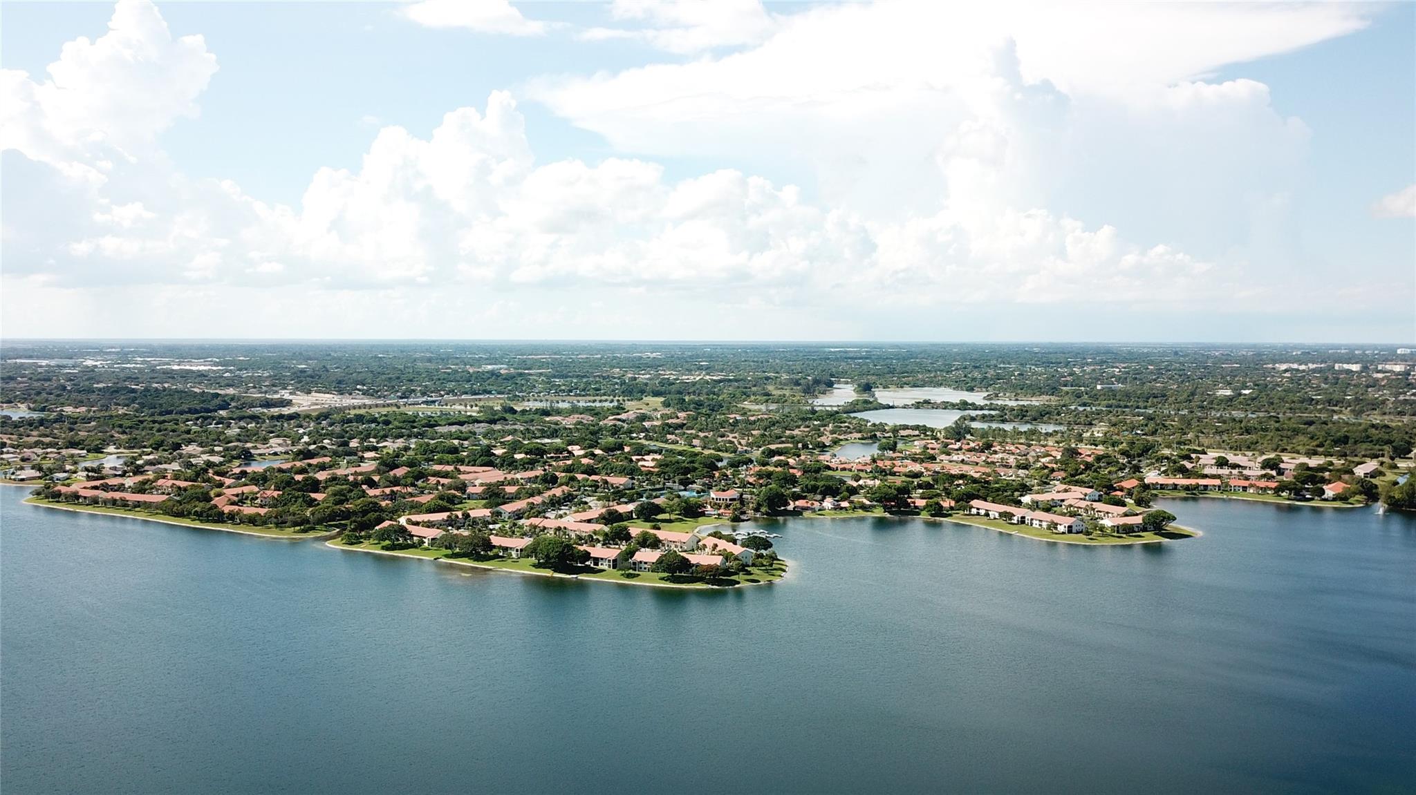 This amazing 3/2 lakefront single family home is completely updated w/no expense spared & is located in the safe, guard-gated resort-like community of Independence Bay. Features include: *New white slim shaker kitchen cabinets w/quartz countertops & blacksplash. *All new stainless appliances. *New center island w/quartz countertop & built-in microwave. *New wood finish porcelain tile floors throughout. *New baseboards in all rooms. *All popcorn removed w/all new ceiling fans & recessed lighting throughout. *All new wood blinds. *A/C 3 years. *Tankless HWH 2 years. *New Electrolux washer/dryer.* Updated master bathroom w/dual sinks. *Updated guest bathroom. *IMPACT WINDOWS & SLIDERS THROUGHOUT. *NEW ELECTRICAL PANELS. *3rd bedroom is modified to an open office but can easily be changed back