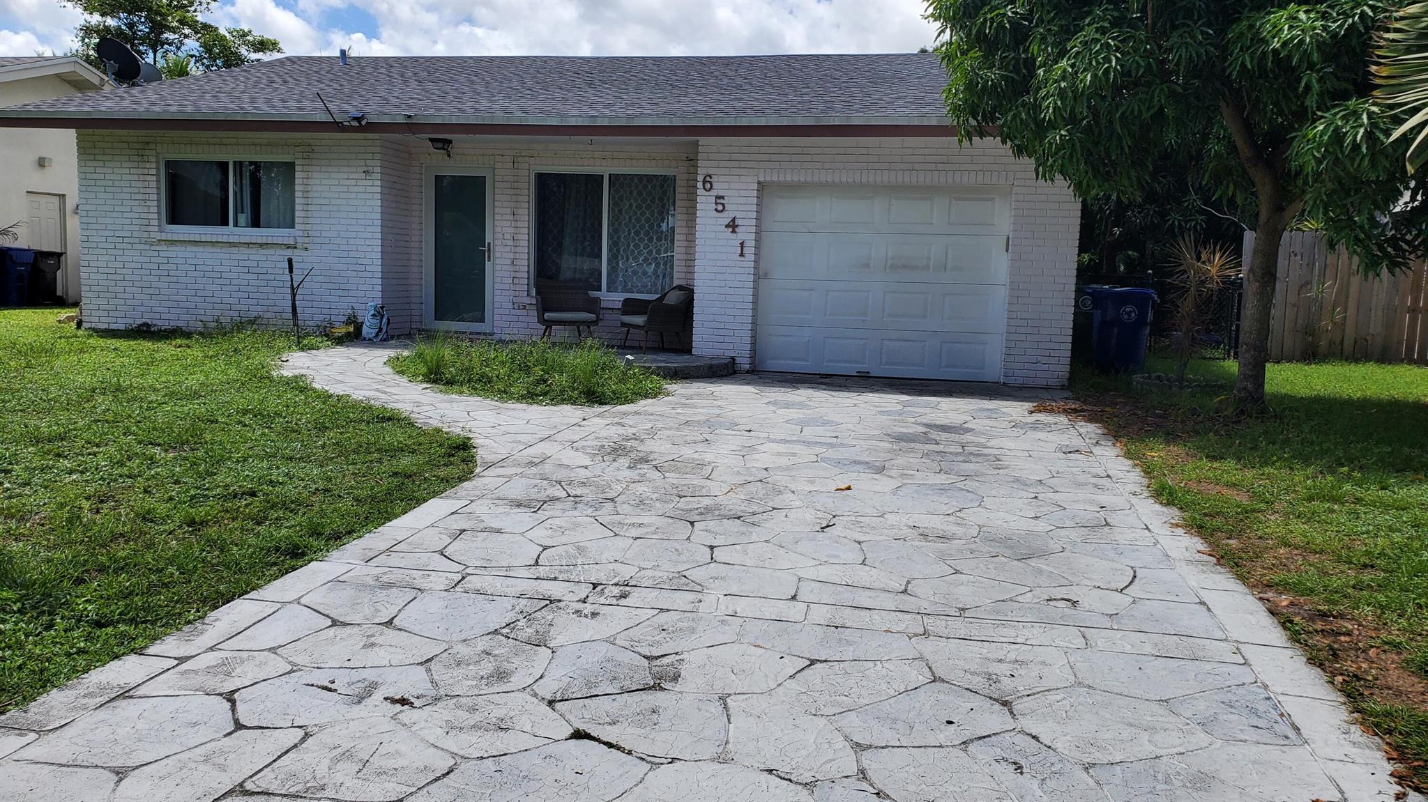 This hidden gem on a lake is ready for move-in. 2/2 or 3/2, 3rd room in the back with its own sitting area that can be used as 3rd bedroom, office or efficiency. Fishing deck with mango trees, wired fence. Recently renovated, roof is 4 years old, brand new AC with entire new duct throughout the house, impact windows and doors, new appliances, knockdown ceiling and walls, new electrical panel and water heater. Open concept, brand new kitchen with quartz countertop, gray shaker cabinets. No HOA, room for pool.