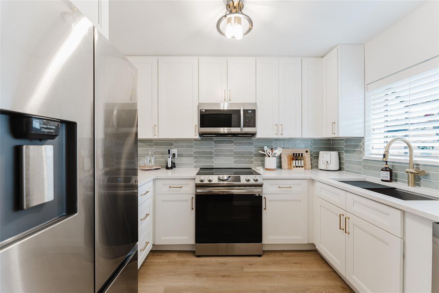 Fully Furnished- Turn Key! FIRST FLOOR ENTRY & Gorgeous water views! This 2 bedroom plus a den home has been elegantly designed and offers a split bedroom floorplan. The kitchen features 46” cabinets, gold accent hardware, thick 3cm 1 1/4" Calacatta quartz countertops, new appliances, a reverse osmosis system, Nest thermostat, brand new lighting and beautifully renovated throughout. Independence Bay is a 24-hour guarded community & offers resort-style living, with beautiful landscapes, scenery, tennis courts, fitness center, walking paths, boating, & multiple swimming pools. Located near restaurants, shops, parks, & just a short drive to the beach. Deerfield Beach offers a variety of events, festivals, & activities throughout the year.