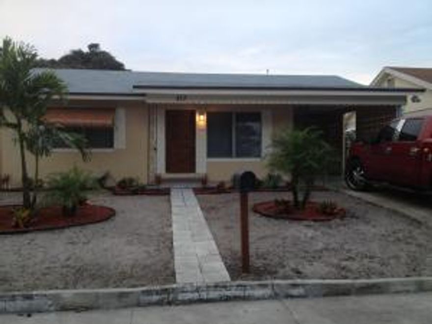 Complete Renovation of a 3br/2bth home with fenced in yard. New Roof, New Central A/C, New custom Granite kitchen, 2 New Baths w/wood stained vanities. Large Master bedroom w/his & her closets & tile flooring, Living rm & other bedrooms have real wood flooring. Freshly painted in & out! Washer/Dryer off kitchen & private driveway & Carport. This is a must See! Front yars to have new sod installed.