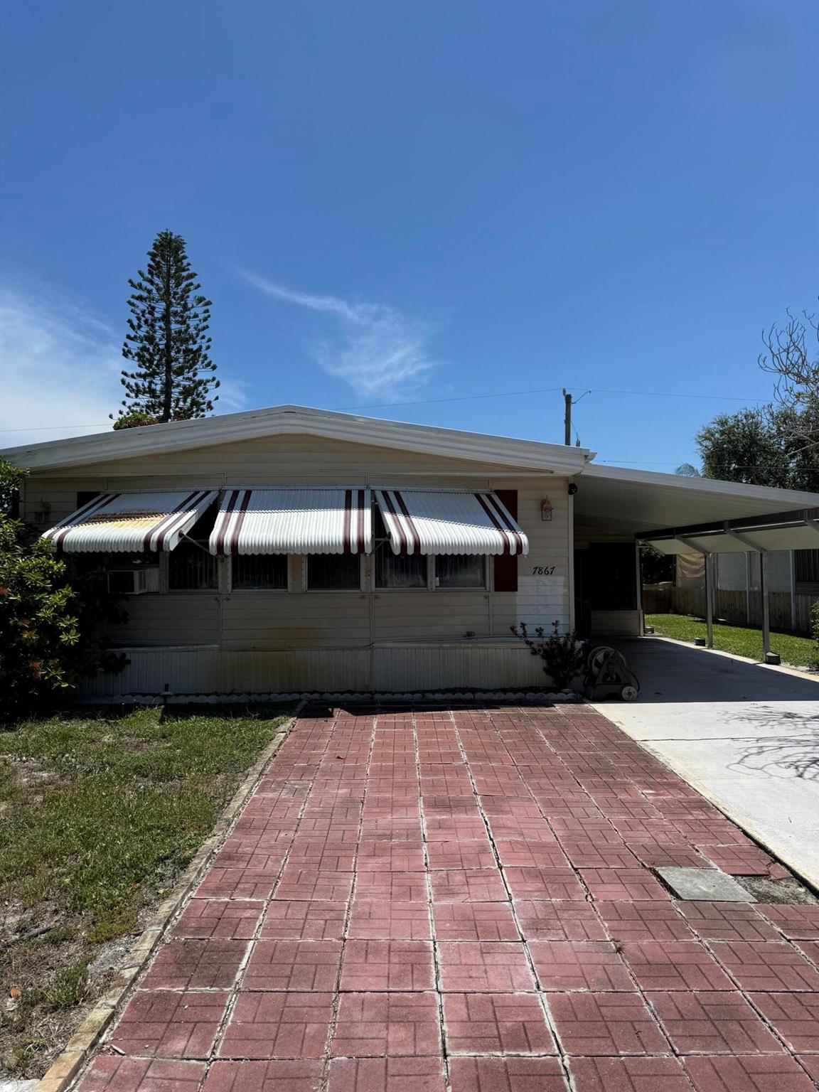 Welcome to this spacious 2bed/2bath manufactured home offering 1,440 square feet of comfortable living space. Situated on your own land, it blends function and flexibility with an open layout. Youll love the kitchen, where a wall was removed to create a seamless flow into the living room. A large island countertop adds both style and extra prep space. Both bedrooms are generously sized, and two full baths. Pets are welcome, so bring your furry friends! Plus, enjoy optional access to community amenities including a pool and clubhouse with a voluntary annual membership. no required HOA. Located just a short drive from Jupiter beaches. Whether you're looking for a seasonal retreat or a fulltime residence, this property delivers affordability and Florida sunshine.