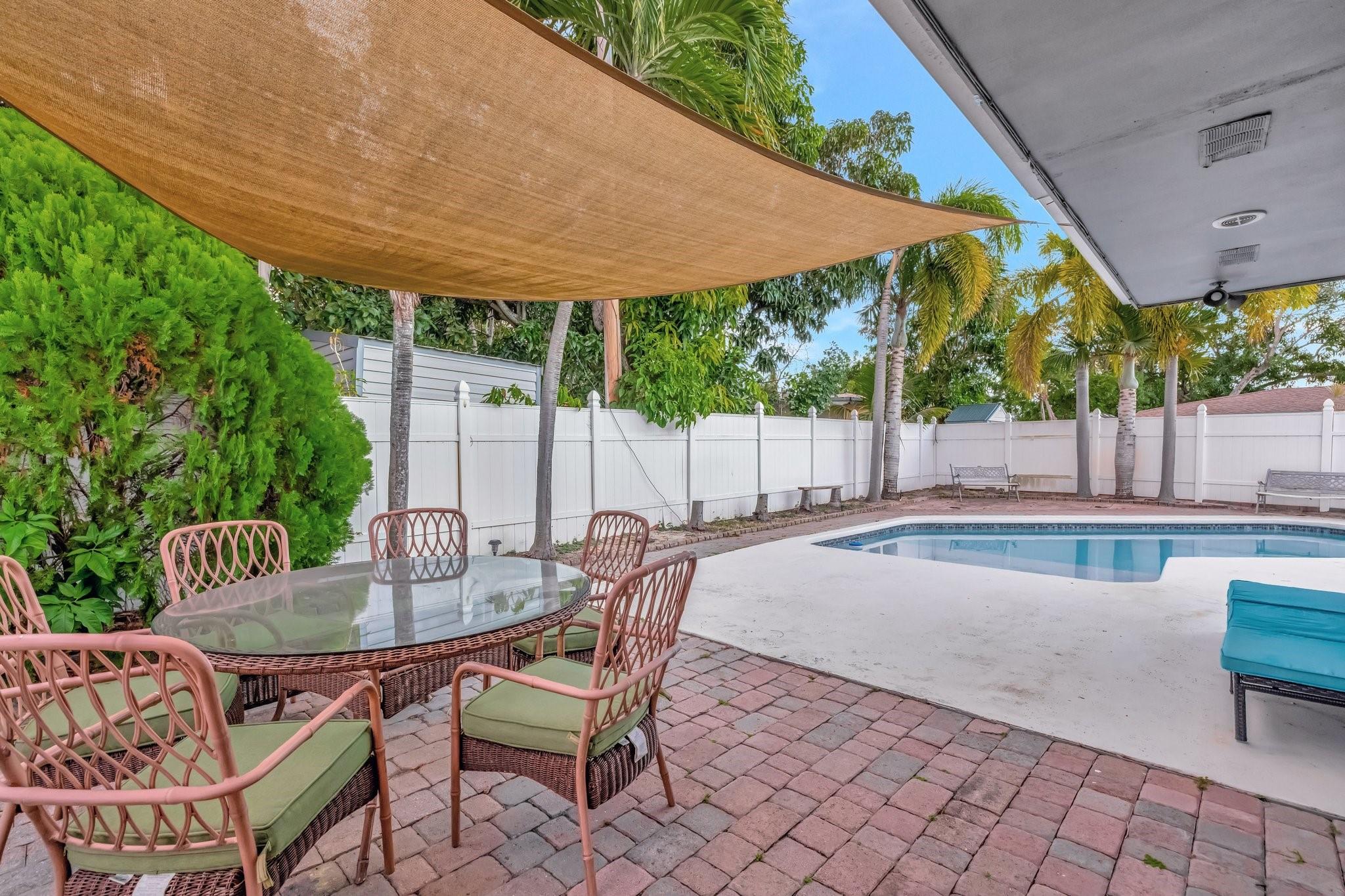 Fabulous updated 1-story home in Pompano Beach offering a flexible 4-bedroom layout—3 true bedrooms plus a bonus room with closet (no window), perfect as a guest room, office, or flex space. Enjoy 2 spacious primary suites, one with a private entrance, ideal for guests, in-laws, or great income potential! Split floor plan, beautiful tile flows throughout, stylish updated bathrooms with frameless showers, and an oversized laundry room with sink! A fabulous well designed kitchen with quartz countertops, spice pullouts, lazy Susan, a deep sink & stainless steel appliances! Additional bonus room makes a great office or creative space. New roof (2022), newer A/C, water heater, and pool pump. Fully fenced backyard with room to relax or entertain. Move-in ready bring any reasonable offer!