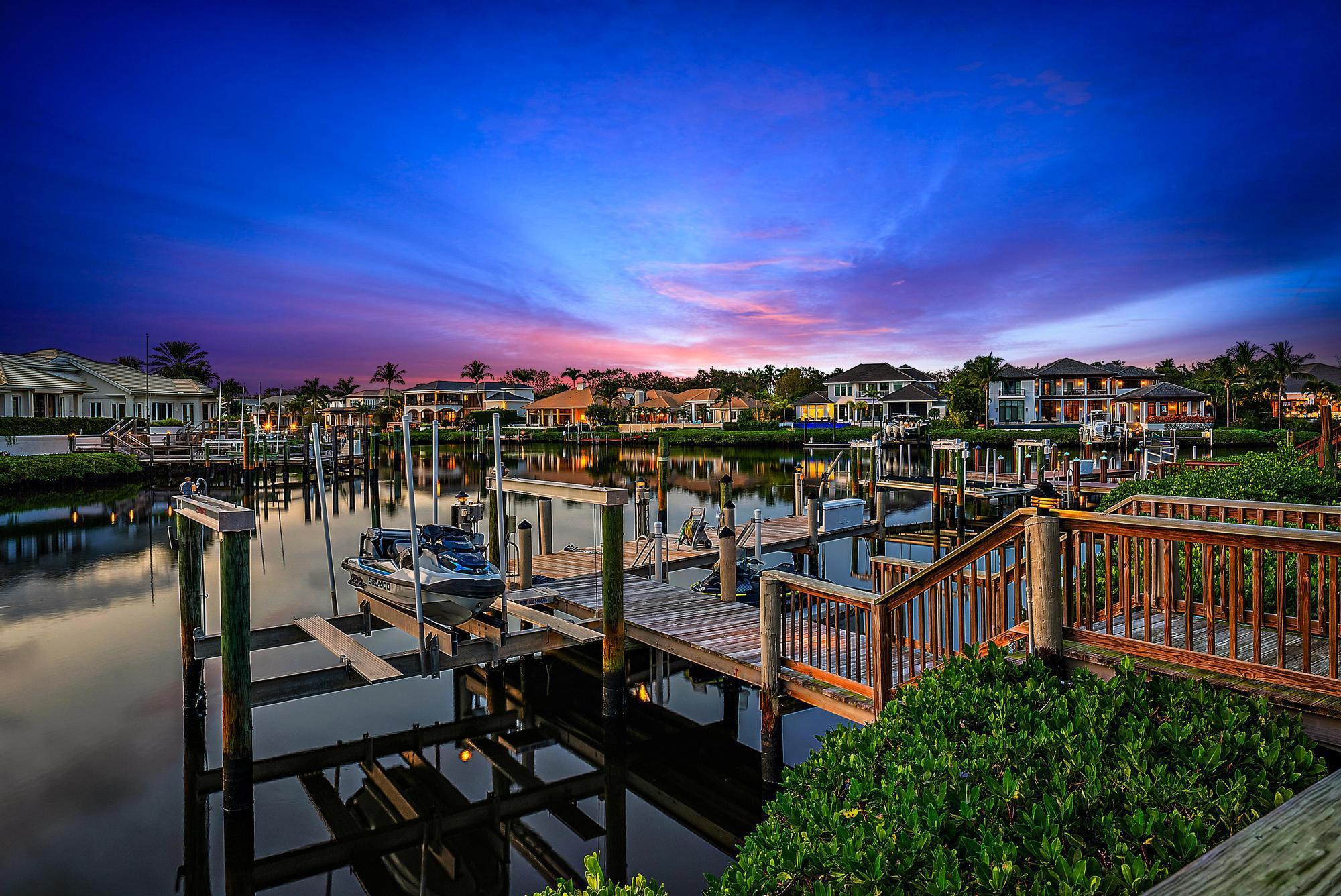Boaters Paradise - with over 100' of prime water frontage this home is perfect for those who like water crafts. Located on a quiet cul-de-sac in prestigious Admirals Cove this property is a dream opportunity. The interior of the home has been upgraded, large guest rooms, stunning primary bedroom and bath and 3.5 car garage. No better sunsets than from this property that has water views from 3 different directions.This property will not last!!