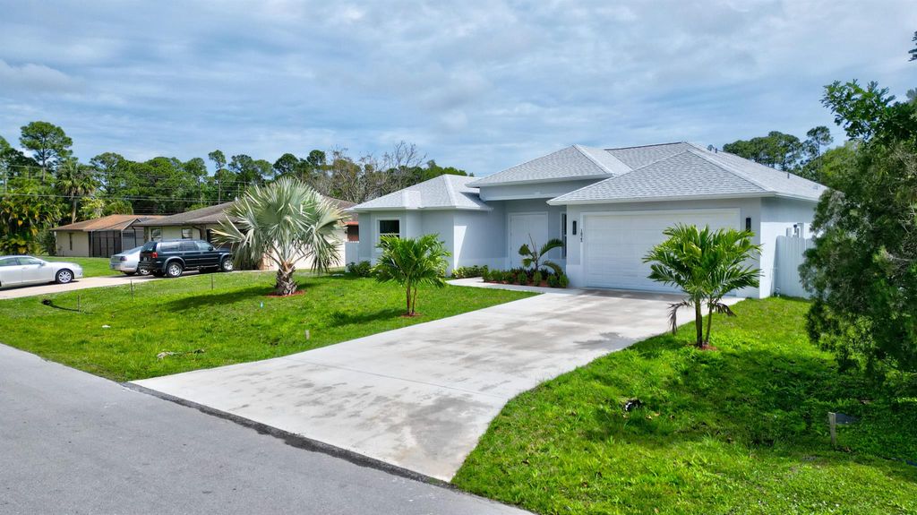 Photo of 1825 SW Logan Street, Port Saint Lucie, FL 34953 (MLS # R10943294)