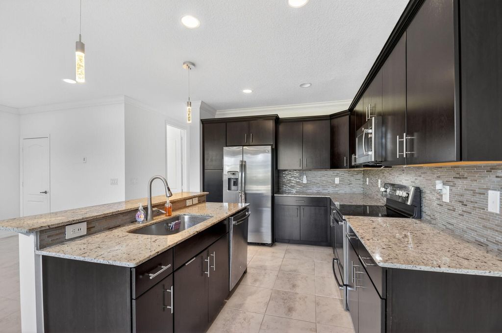 Photo of 4545 Tara Cove Way, West Palm Beach, FL 33417 (MLS # R11158813)